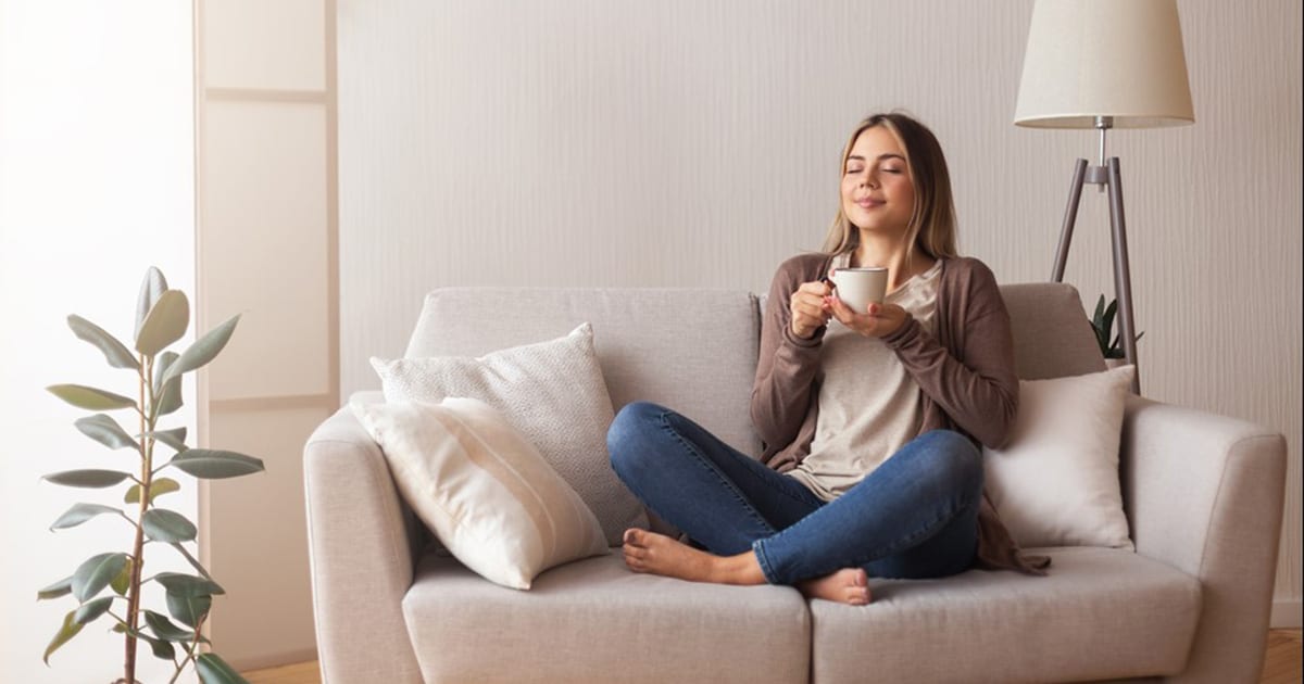 women on sofa enjoying indoor air quality monitor